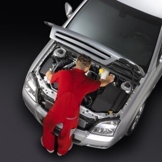 Man fixing engine Man fixing engine
