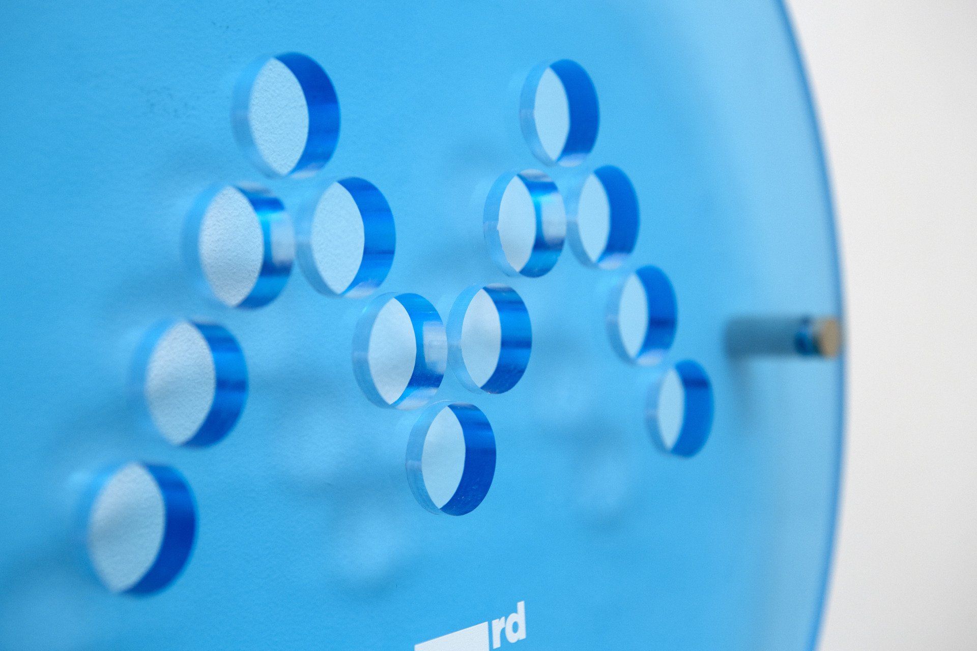 A close up of a blue object with circles on it