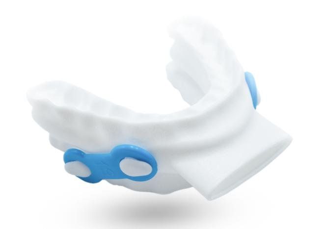 White-and-blue wrist blood pressure monitor cuff on a white background