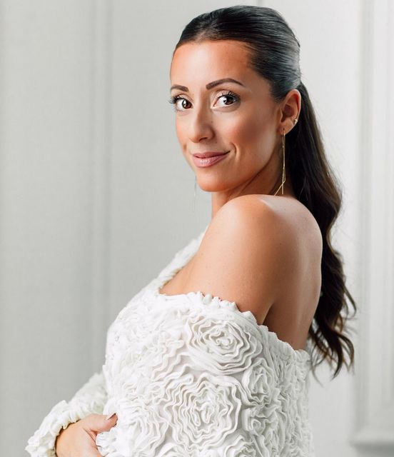 Woman wearing white off shoulder top