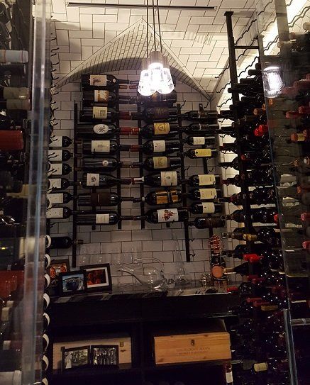 A wine cellar filled with lots of bottles of wine