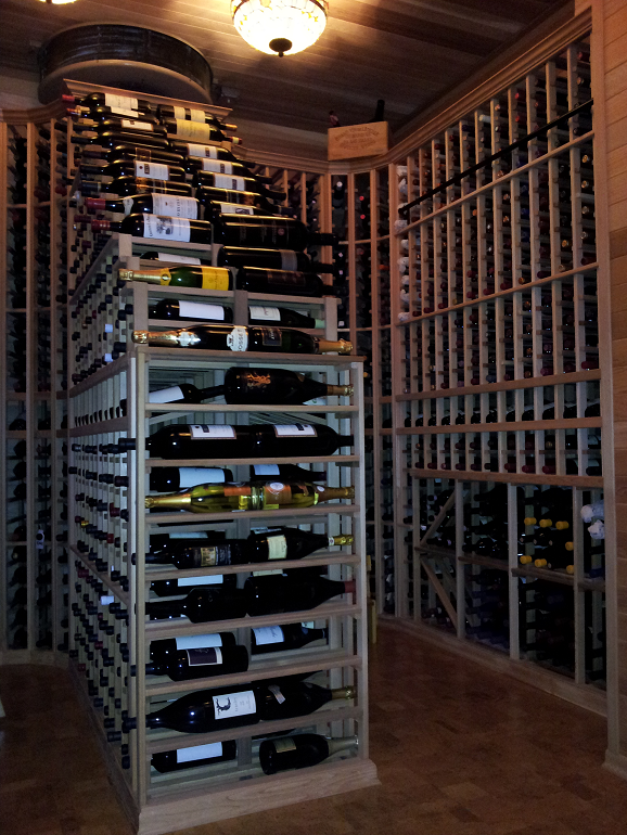 A wine cellar filled with lots of bottles of wine