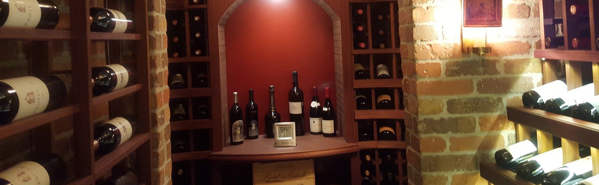 A wine cellar filled with lots of bottles of wine