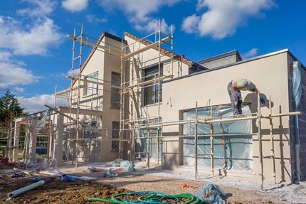 Painter painting the exterior of a house in Loomis, CA