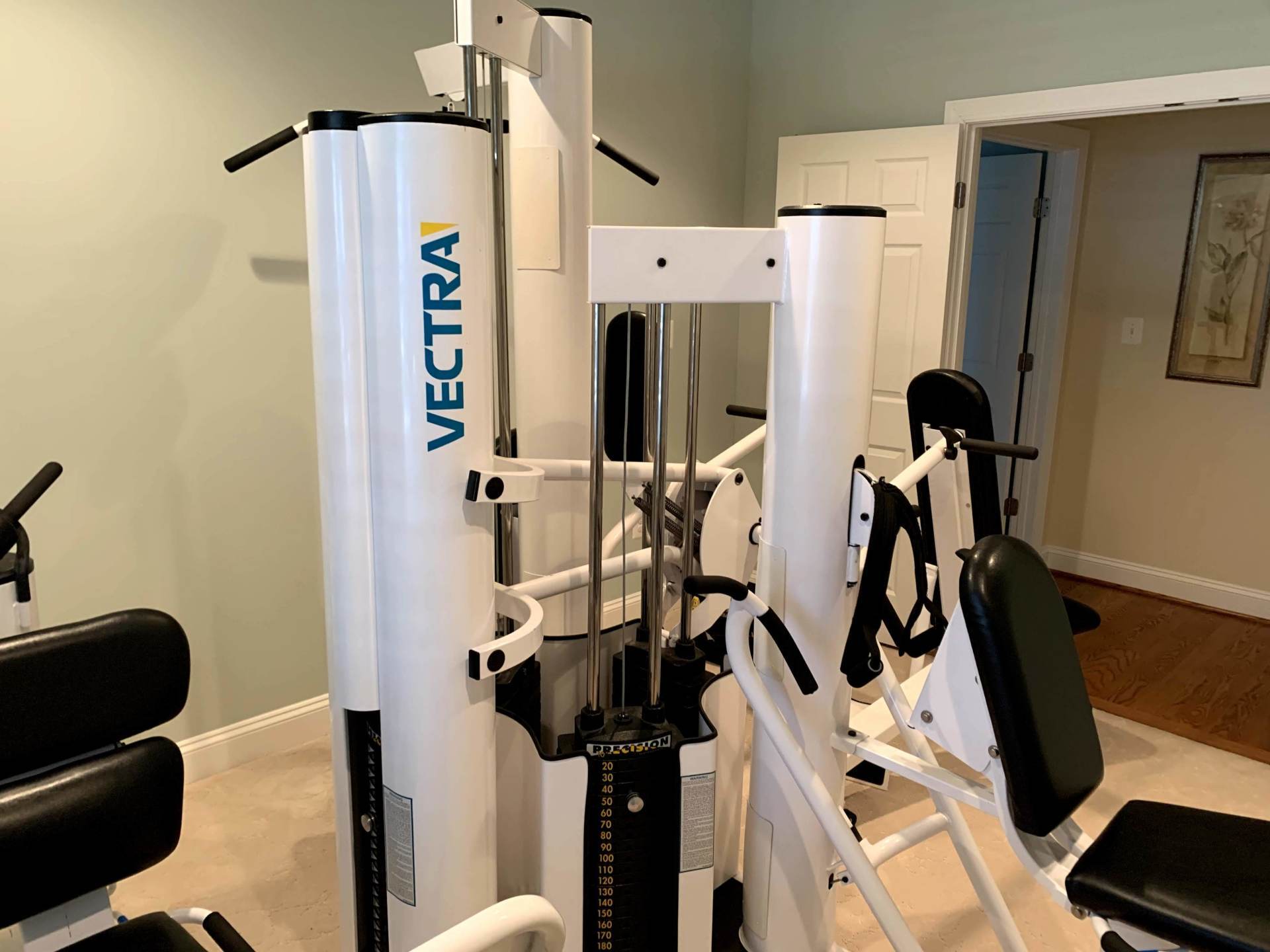 White pillar Vectra seat home gym assembled by furnitureassemblyteam