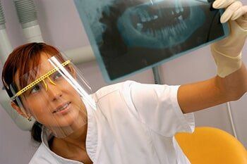 Looking at xray - Dentist care in KY, USA Looking at xray - Dentist care in KY, USA