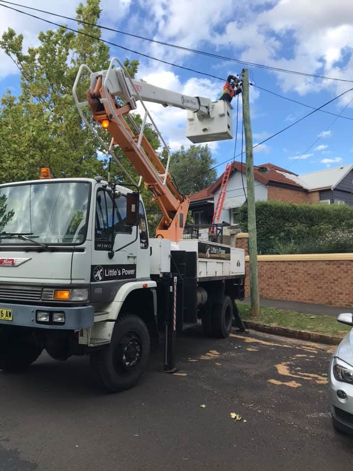 Electrician Fixing Power line — Electrical Services in Orange, NSW Electrician Fixing Power line — Electrical Services in Orange, NSW