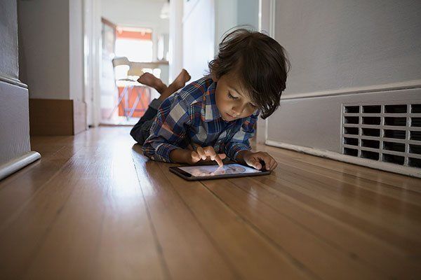 Child Playing In Gadget — Jacksonville, FL — The Law Office Of Gerald Wilkerson PA