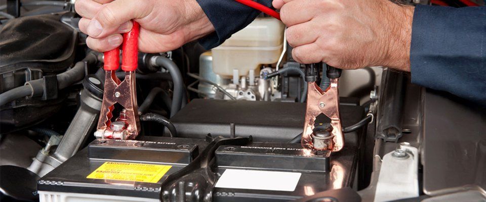 clipping jump leads onto a battery