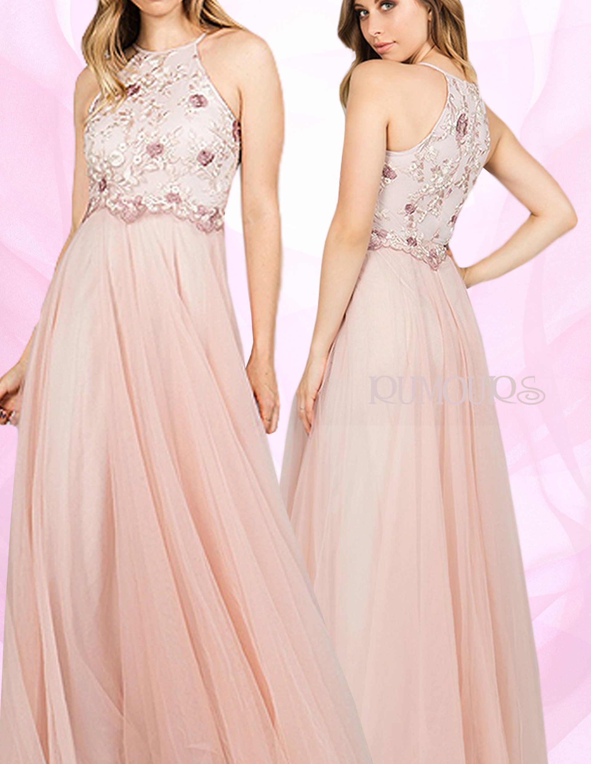 Two women in blush pink, halter-neck formal dresses, one facing forward, the other turned.