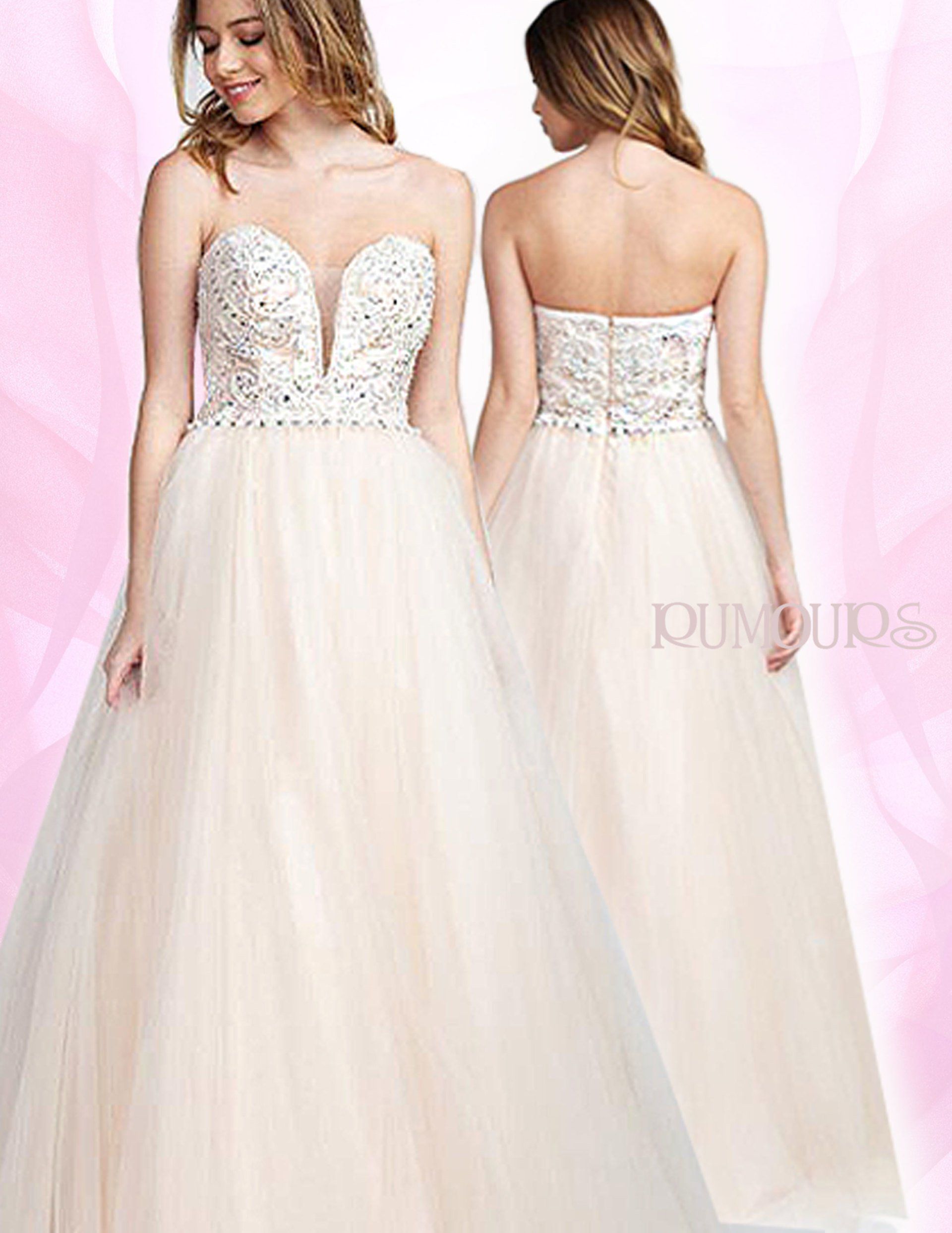 A strapless, cream-colored formal gown with a beaded bodice and tulle skirt.