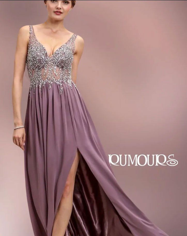 Woman in mauve formal dress with jeweled bodice and high slit.