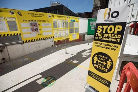 Construction site with Coronavirus Covid 19 safety measures and social distancing