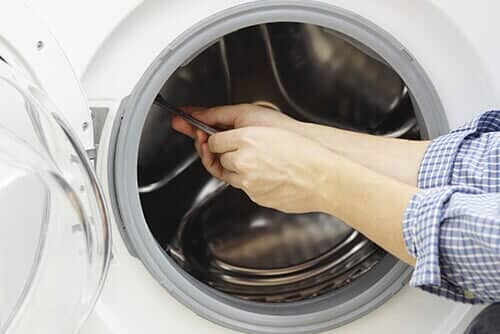 Technician Repairing a Washing Machine - Appliances Repair in Worth, IL