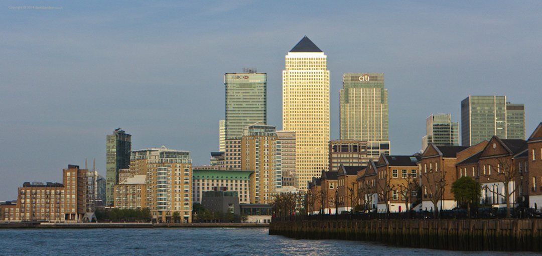 Canary Wharf London from a boat on the River Thames.