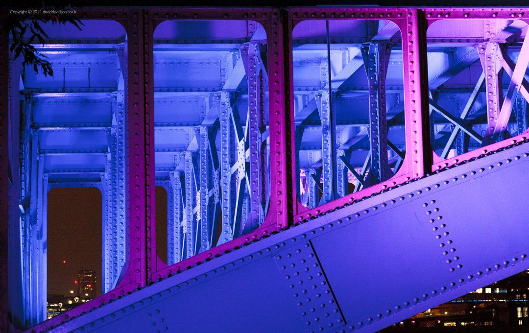The under side of Blackfriars Bridge London at night.