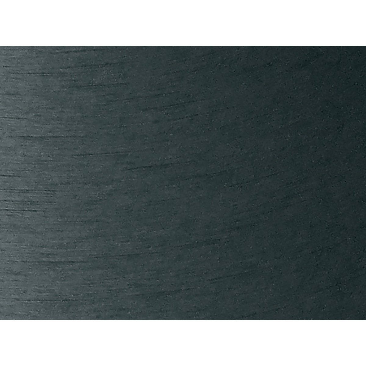 A close up of a piece of black paper on a white background.