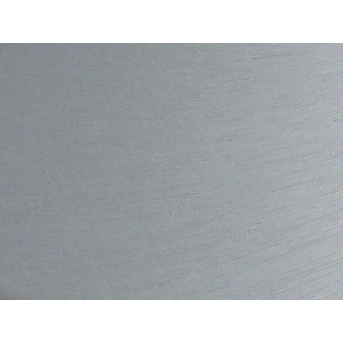 A close up of a piece of stainless steel on a white background.