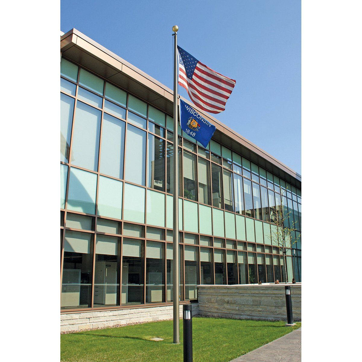 An american flag is flying in front of a building