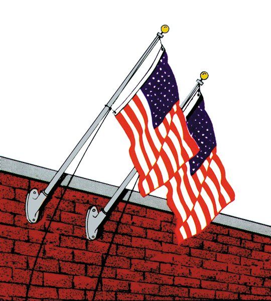Two american flags are hanging from a pole on a brick wall