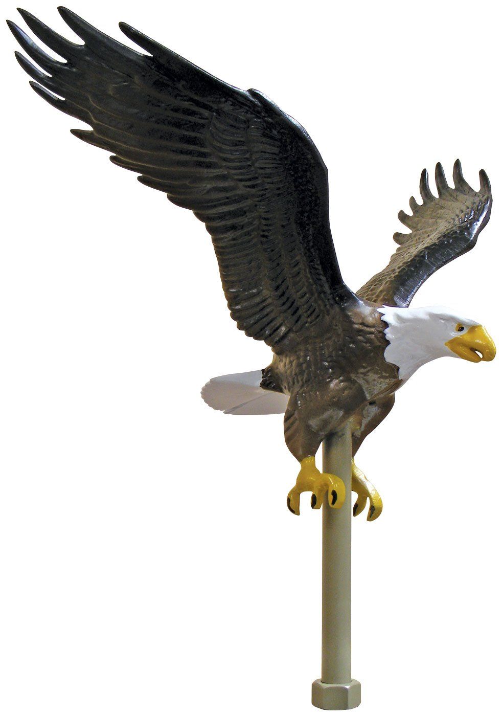 A bald eagle is standing on a pole with its wings spread.