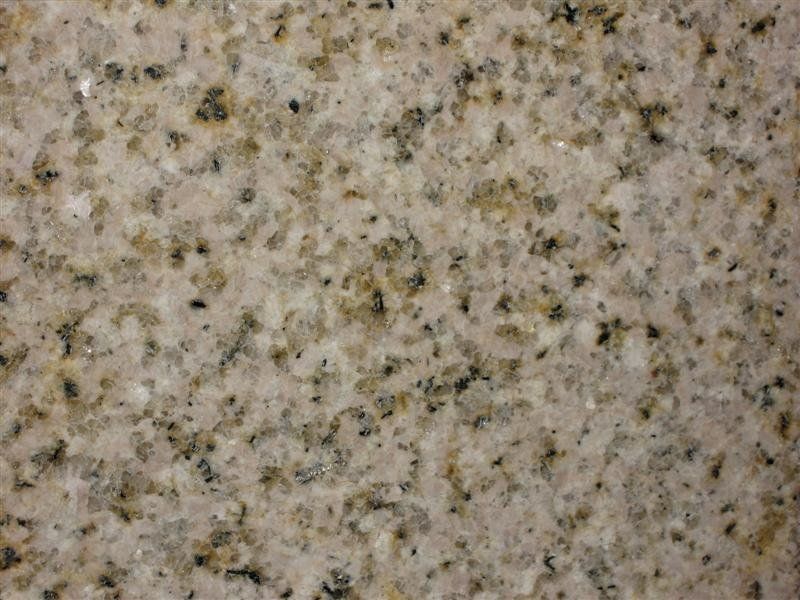 A close up of a granite counter top with a lot of small stones on it.