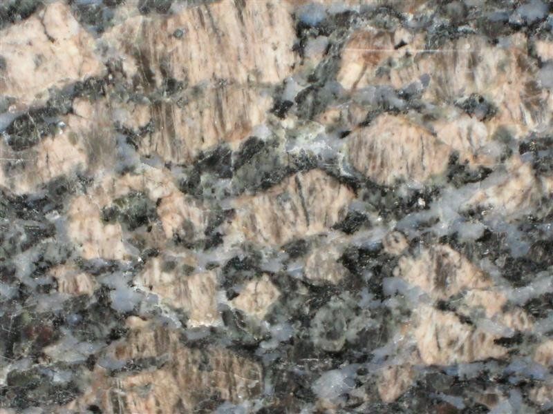 A close up of a piece of granite with a marble texture.
