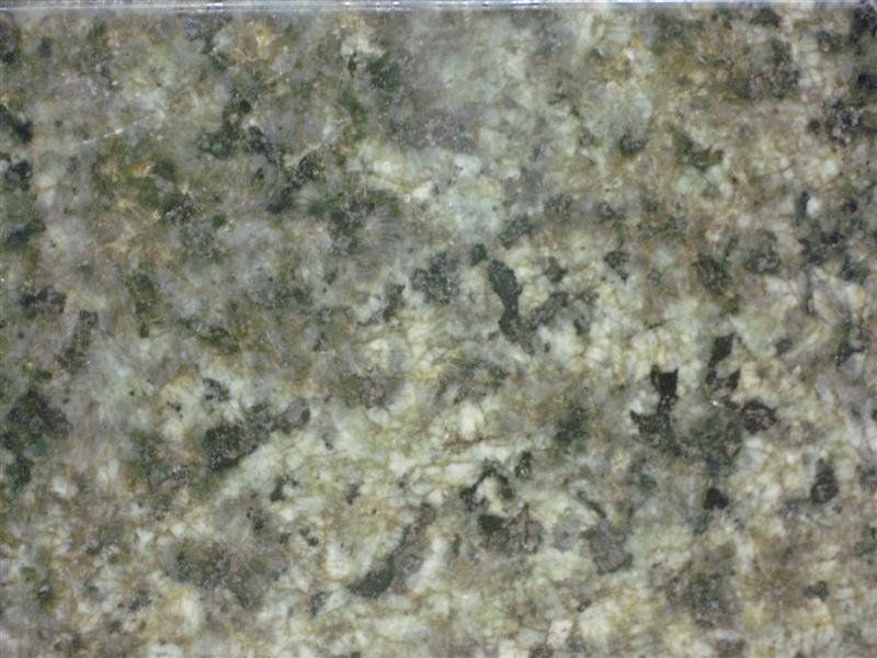 A close up of a granite counter top with a marble texture.