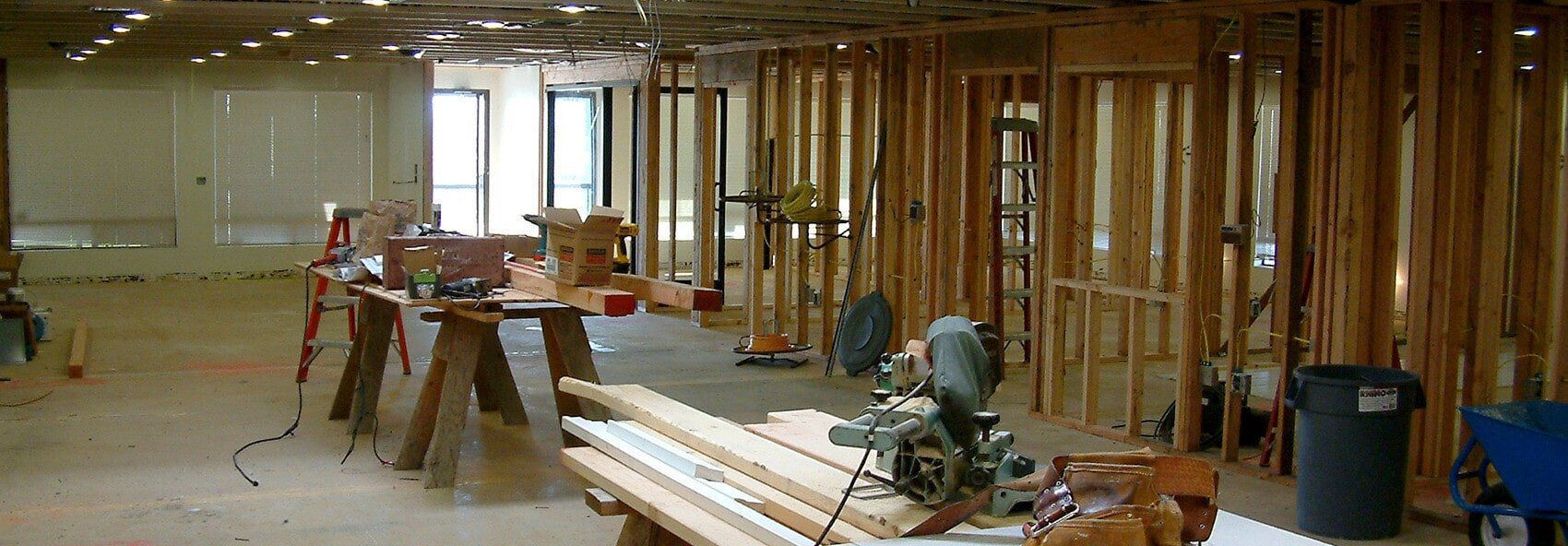 A room that is being built with a lot of wood and tools.