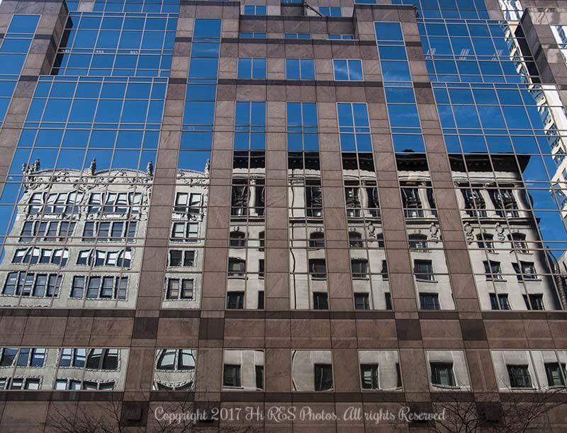 A building with a lot of windows and a blue sky in the background