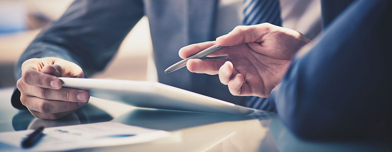 a man holding a pen