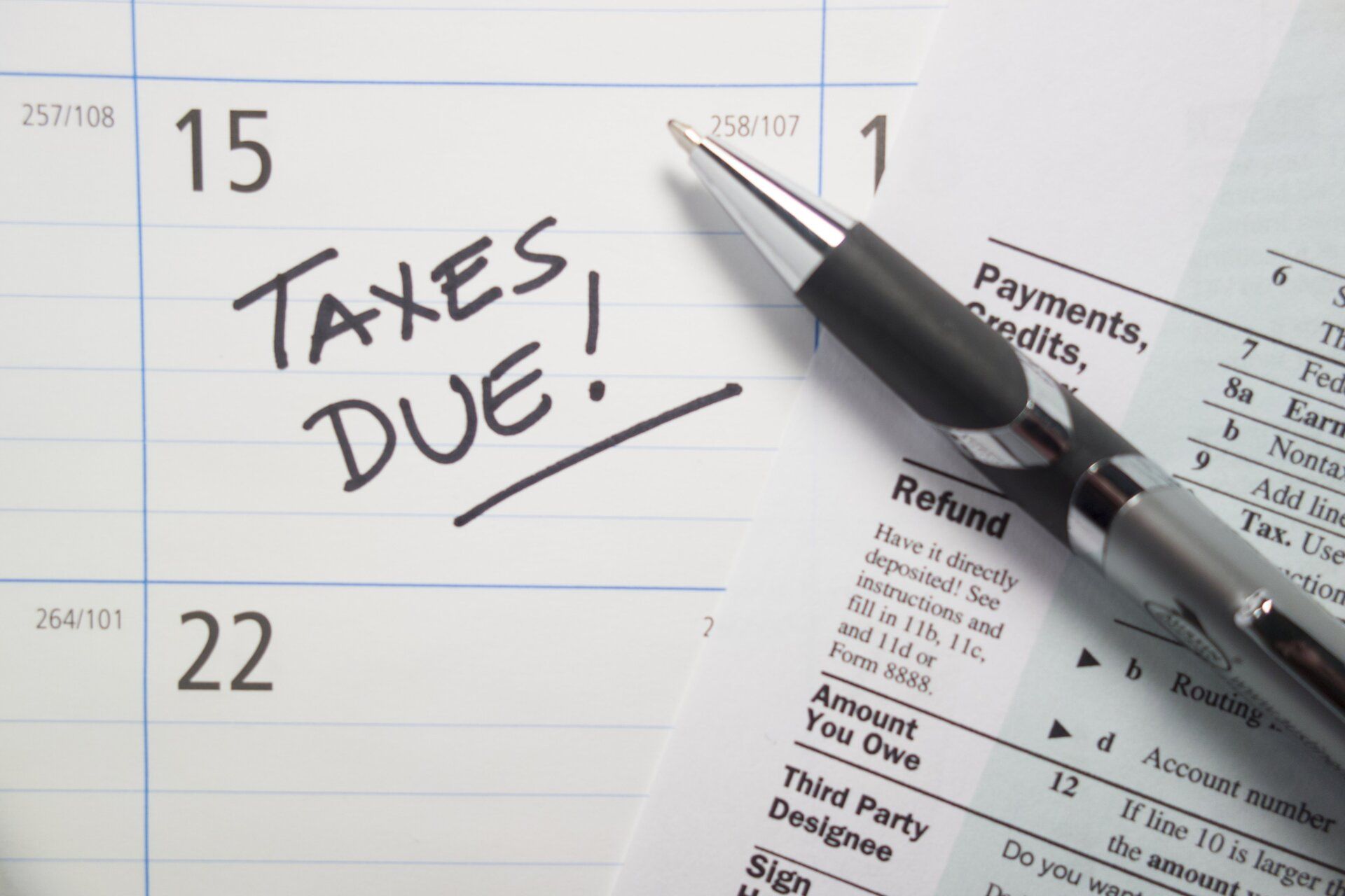 A calendar with the words taxes due written on it