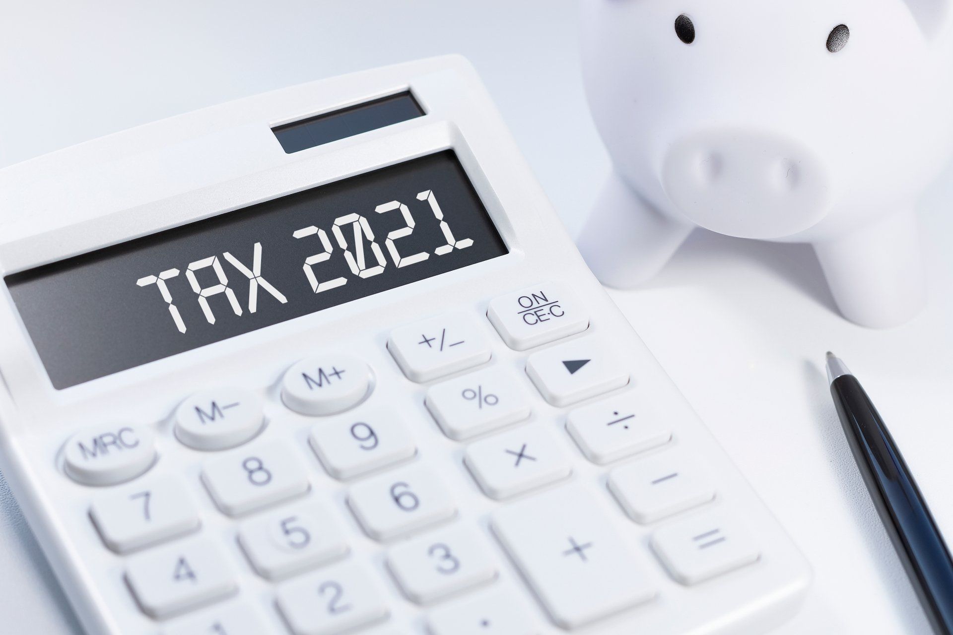 A white calculator with the words tax 2021 on it