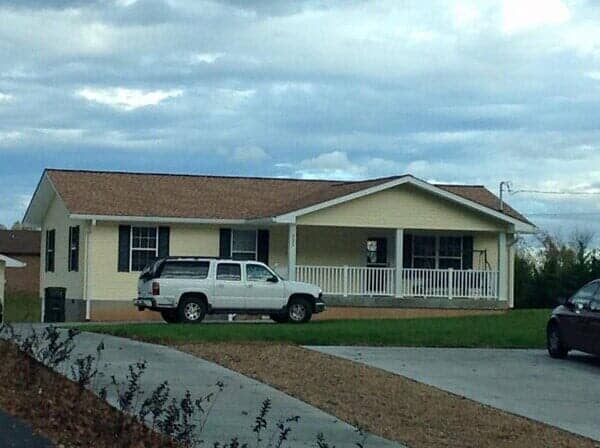 Big house with car — custom siding in Elizabethton, TN