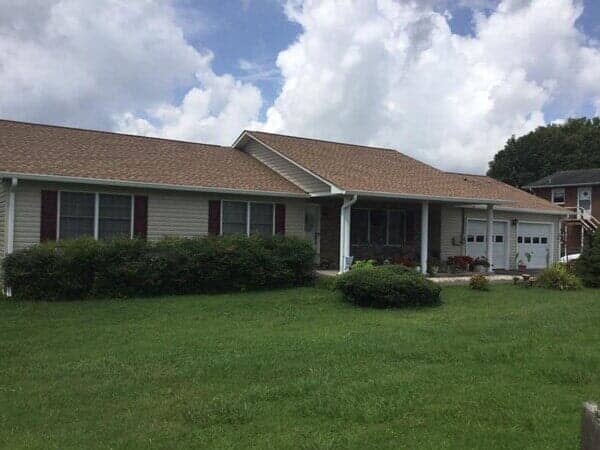 Big one story house with brown roof  — custom siding in Elizabethton, TN