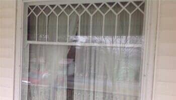 Window with curtain inside — vinyl replacement windows in Elizabethton, TN