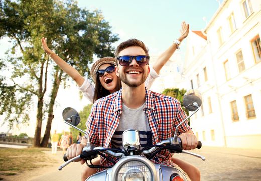 Energetic Couple - Portrait Of Happy Young Couple On Scooter Enjoying Road Trip in Atlanta, GA Energetic Couple - Portrait Of Happy Young Couple On Scooter Enjoying Road Trip in Atlanta, GA