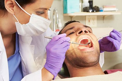 Loose Teeth — Dentist Checking Man Teeth in Mansfield, OH Loose Teeth — Dentist Checking Man Teeth in Mansfield, OH