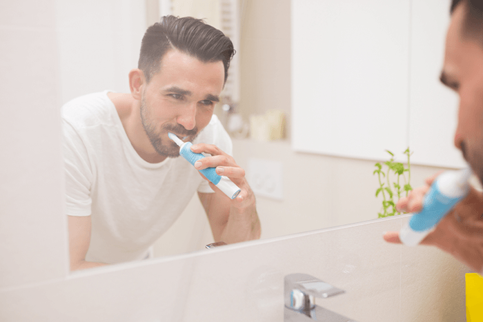 General Dentist — Man Brushing His Teeth in Mansfield, OH General Dentist — Man Brushing His Teeth in Mansfield, OH