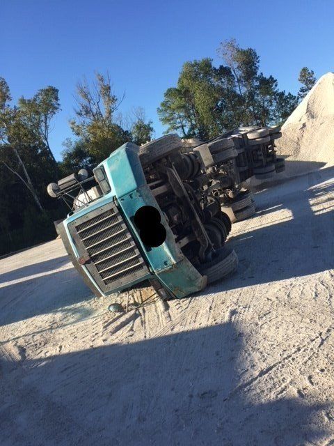 Truck Towing — Tipped Over Heavy Duty Truck in Houston, TX