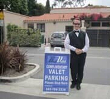 Valet Services - Valet Giving Car Key To Businessperson in Garden Grove, CA Valet Services - Valet Giving Car Key To Businessperson in Garden Grove, CA