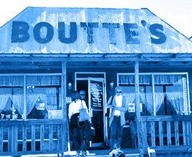 People standing outside a restaurant called boutte 's