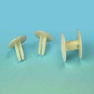 Tornillos de plástico blanco con cabezas planas y vástagos divididos sobre un fondo degradado de color azul verdoso.