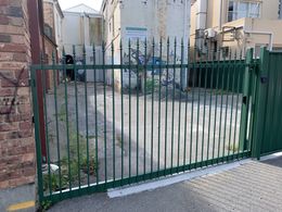 people in pool with fence