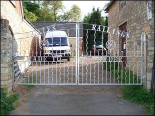 Silver iron gates manufactured and installed by TME Fabrication & Welding