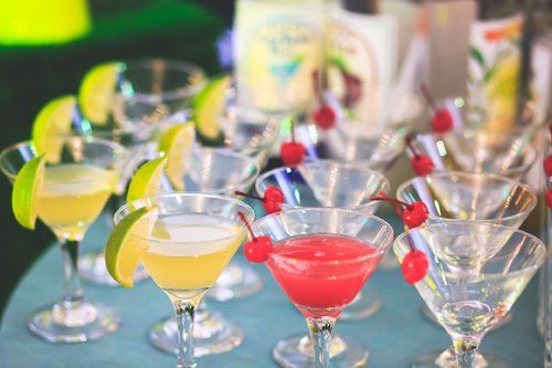 Beautiful row line of different colored alcohol cocktails