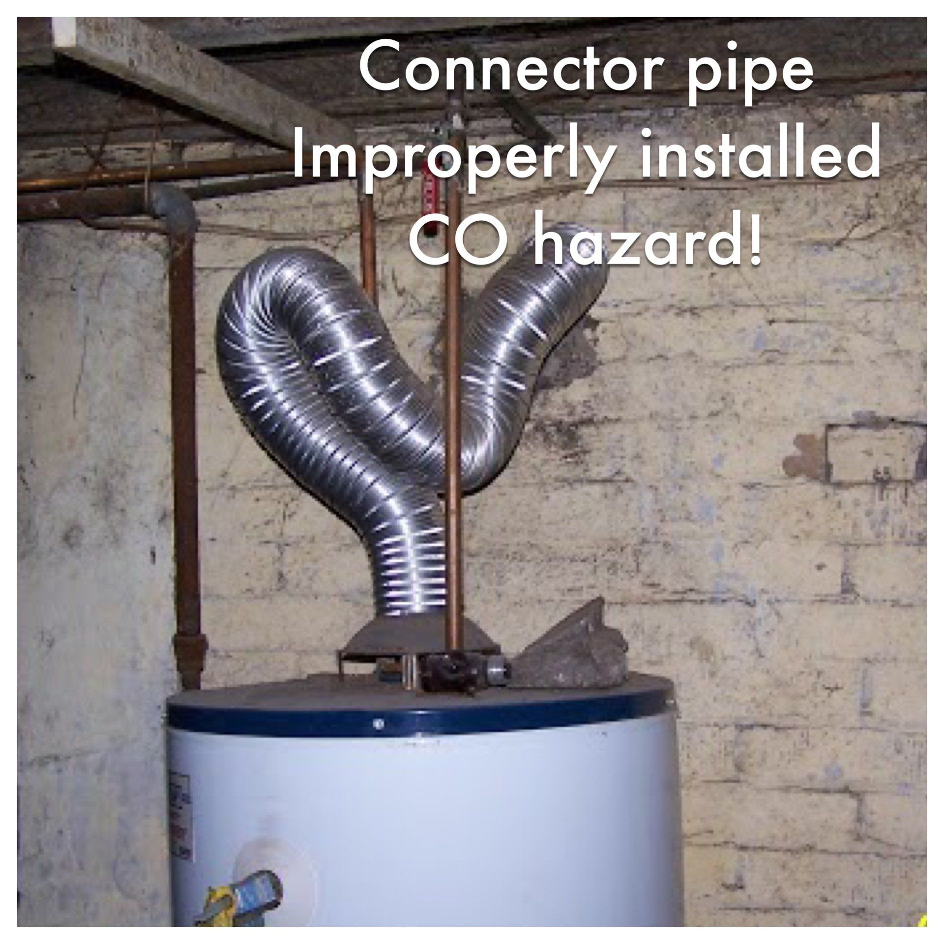 Improperly installed water heater vent pipe; risk of carbon monoxide poisoning in basement.