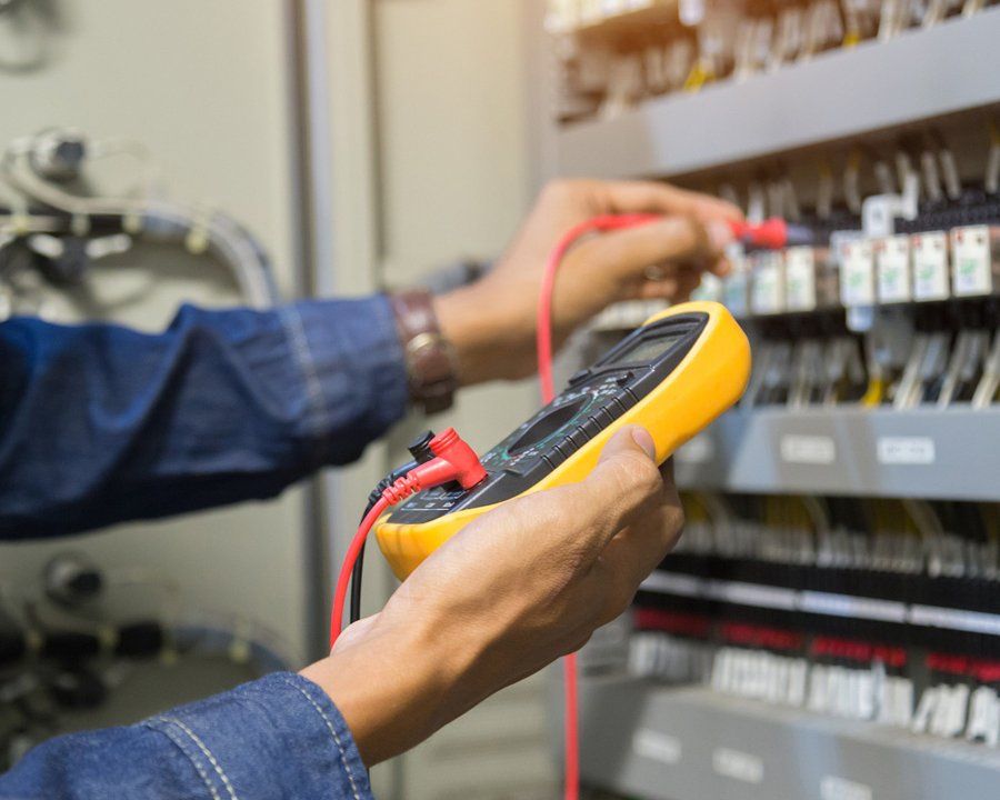 Electrician engineer work tester measuring voltage
