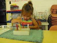 Kid playing stick — Preschool & Daycare in Virginia Beach, VA Kid playing stick — Preschool & Daycare in Virginia Beach, VA