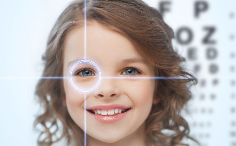 Young person with eye exam equipment